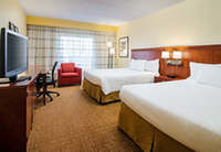 Room, 2 Queen Beds: <strong>2 Queen Beds</strong><br />396 sq feet (37 sq meters)<br /><br /><b>Internet</b> - Free WiFi <br /> <b>Entertainment</b> - Flat-screen TV with cable channels<br /><b>Food & Drink</b> - Coffee/tea maker<br /><b>Bathroom</b> - Private bathroom, shower/tub combination, free toiletries, and a hair dryer<br /><b>Practical</b> - Desk and iron/ironing board<br /><b>Comfort</b> - Air conditioning and daily housekeeping<br />Non-Smoking<br />Connecting/adjoining rooms can be requested, subject to availability <br />&nbsp;