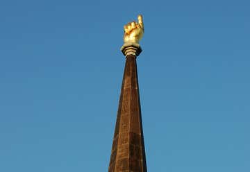Photo of Large Golden Hand on Steeple