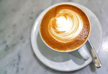 Photo of Tall Latte Cup-Shaped Espresso Drive Thru
