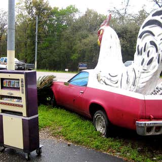 Chicken Statue and Car