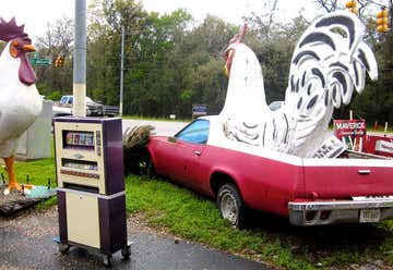 Photo of Chicken Statue and Car