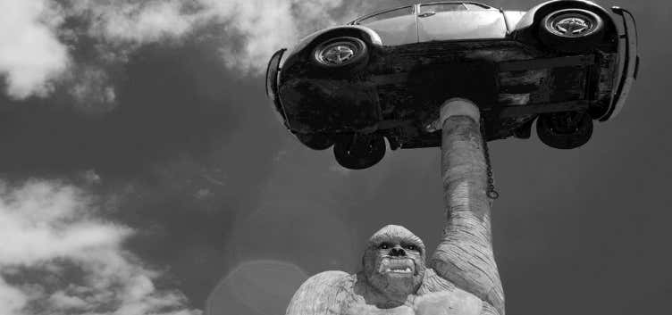 Photo of Gorilla Holding A VW Beetle