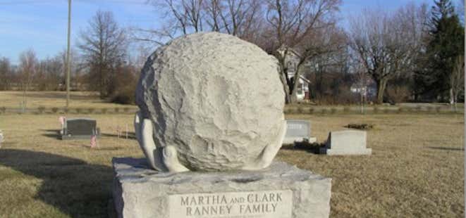 Photo of Hand-holding globe headstone