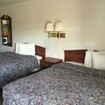 Deluxe Room, 2 Bedrooms: <strong>2 Queen Beds</strong><br />300 sq feet (28 sq meters)<br /><br /><b>Internet</b> - Free WiFi <br /> <b>Entertainment</b> - Cable channels <br /><b>Food & Drink</b> - Refrigerator, microwave, and coffee/tea maker<br /><b>Bathroom</b> - Private bathroom, free toiletries, and a bathtub<br /><b>Practical</b> - Free local calls<br /><b>Comfort</b> - Air conditioning and daily housekeeping<br />Non-Smoking<br />&nbsp;