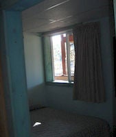 Suite, 3 Bedrooms: <strong>6 Twin Beds</strong><br />1000-sq-foot (93-sq-meter) room with mountain views<br /><br /><b>Layout</b> - 3 bedrooms, living room, and dining area<br /><b>Internet</b> - Free WiFi <br /> <b>Entertainment</b> - Cable channels <br /><b>Food & Drink</b> - Kitchen with refrigerator, stovetop, oven, and microwave<br /><b>Bathroom</b> - 2 bathrooms and shower<br /><b>Practical</b> - A queen sofa bed; free cribs/infant beds available on request<br /><b>Comfort</b> - Air conditioning and heating<br />Non-Smoking<br />
